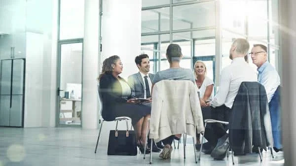 team surrounding table