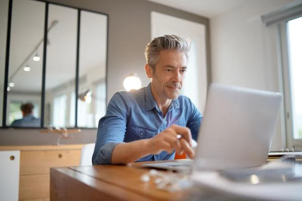 Mature man working from contemporary home