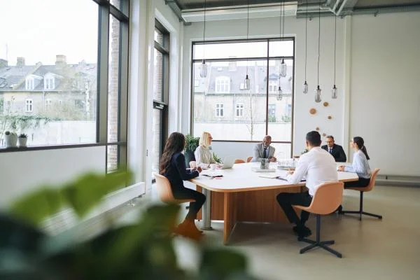 Smiling group of diverse businesspeople having a boardroom meeting