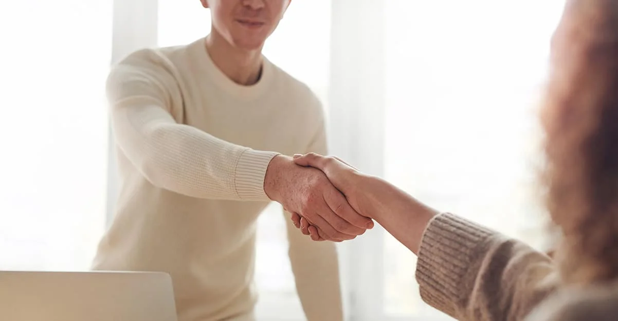 coworkers shake hands